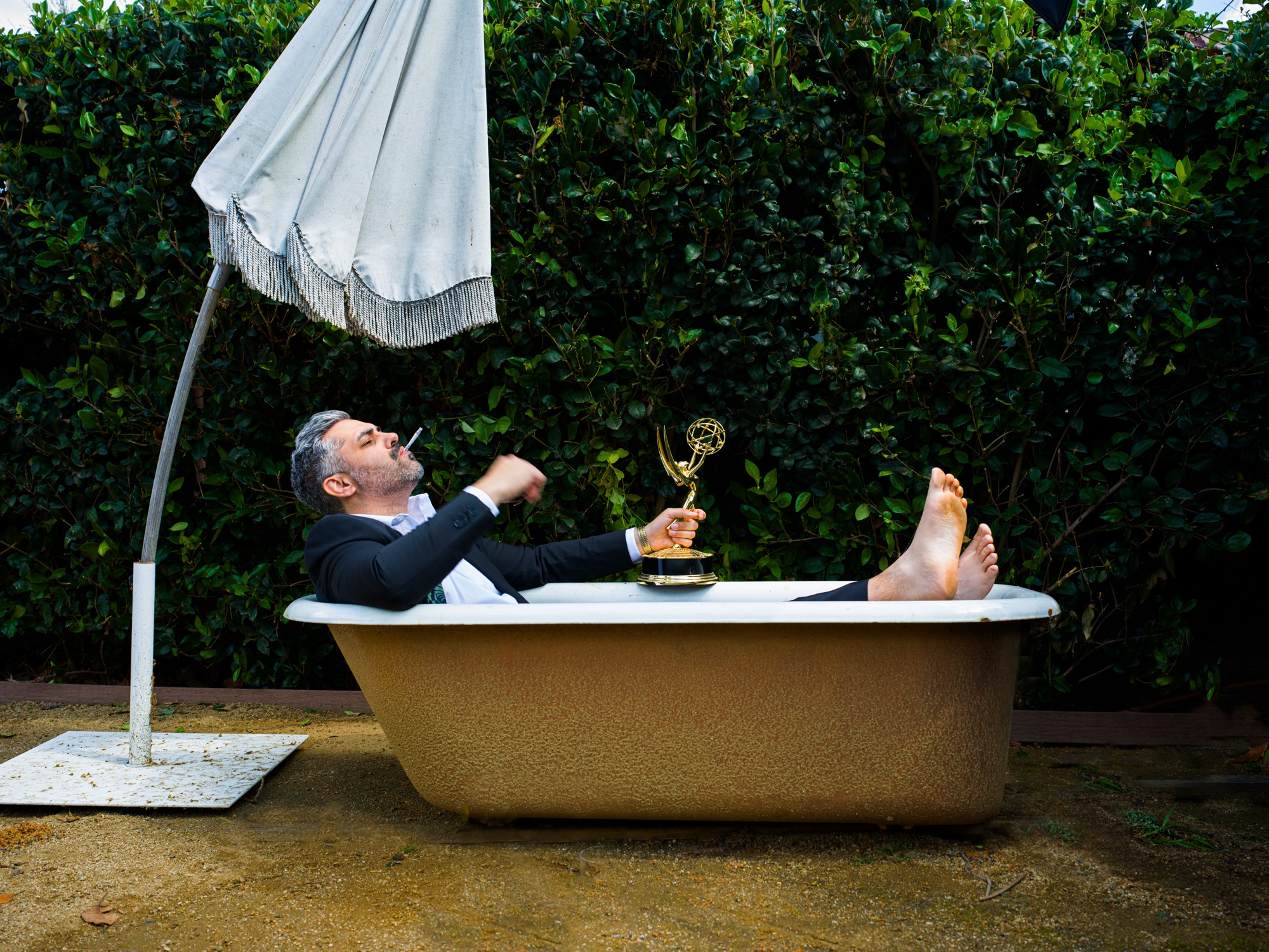 Norm Sousa with Emmy in a backyard tin bath, West Hollywood